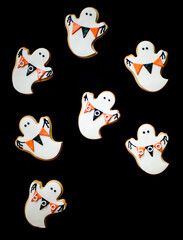 Halloween Ghost Cookies Holding Orange and Black Flags