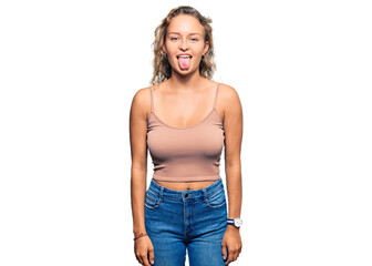 Fototapeta premium Beautiful caucasian woman wearing casual clothes sticking tongue out happy with funny expression. emotion concept.