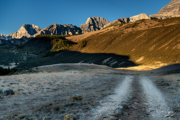 Rugged mountain road leads into the rocky peaks of Idaho