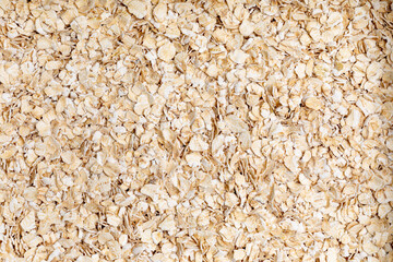 Top view full frame raw oat flakes