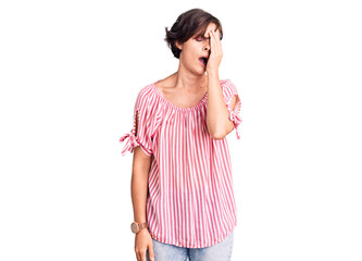 Beautiful young woman with short hair wearing casual summer clothes yawning tired covering half face, eye and mouth with hand. face hurts in pain.