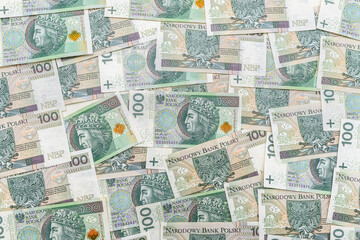Background made of the Polish 100 zloty banknote, background for finance and economy.