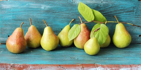 Fresh juicy pears, autumn leaves, on a wooden table, harvest concept, Thanksgiving, healthy...