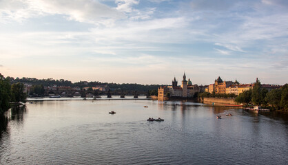 Fototapeta premium Charles bridge prague sunset light beautiful river water panoramic view