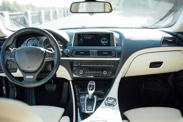 gear knob in a luxury car with beige leather