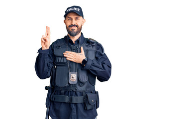 Young handsome man wearing police uniform smiling swearing with hand on chest and fingers up,...