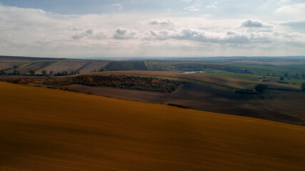 Aerial landscape in Moravia, Czech Republic. Sunrise over rolling hills in Moravia, aerial view of autumn landscapes and dramatic clouds.