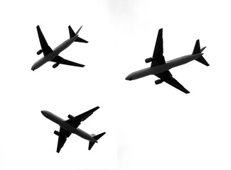 black and white photography,  silhouettes of  Boing 767  in different positions 