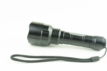 black tactical flashlight on a white background