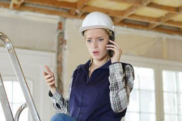 confident woman engineer talking on the cell phone
