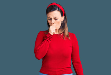 Young beautiful woman wearing casual clothes feeling unwell and coughing as symptom for cold or...