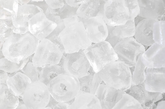 Ice background on the ice bucket. Ice is very cold. Cubes for drinking or cooking.