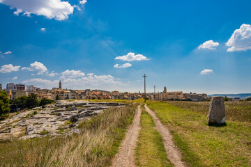 Gravina in Puglia, Italy. The archaeological park of Botromagno at the top of the hill with cave...