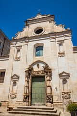 Gravina in Puglia, Italy. The ancient Church of Purgatory (S. Maria del Suffragio), with its beautiful portal surmounted by two statues of skeletons.