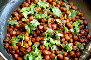 Indian chickpea dish(chana masala) with coriander laves garnish on top