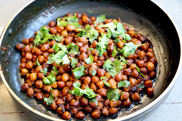 Indian chickpea dish(chana masala) with coriander laves garnish on top