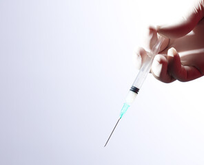 Doctor or nurse holding flu vaccine, syringe for measles injection prepares for baby and adult...