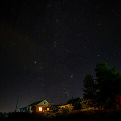 Old house under the starry night sky.