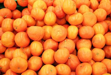 Background from orange tangerines. Proper nutrition, vegetarianism