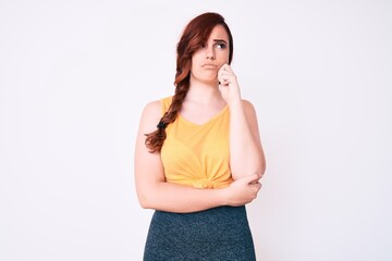 Young beautiful woman wearing casual clothes thinking concentrated about doubt with finger on chin and looking up wondering