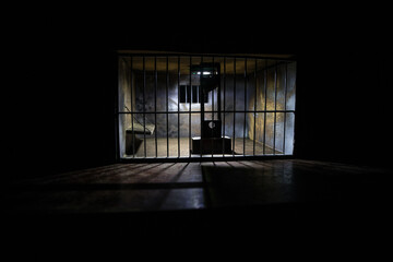 Jail or prison cell. Obsolete gray grunge concrete room. Creative artwork decoration. Horror view...