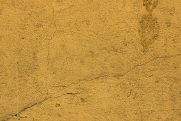 Background yellow old rusty plastered wall