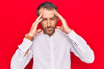 Young handsome man wearing casual clothes with hand on head, headache because stress. suffering migraine.