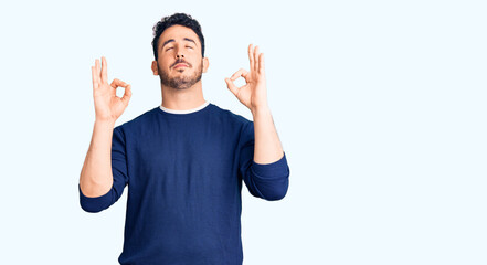 Young hispanic man wearing casual clothes relax and smiling with eyes closed doing meditation gesture with fingers. yoga concept.
