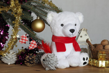 white teddy bear under Christmas tree with christmas gifts