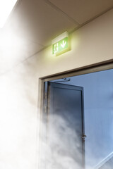 emergency exit and smoke in the building
