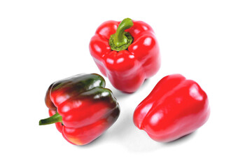 sweet pepper, three fresh natural red peppers on a white background