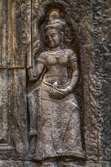 Fototapeta na wymiar Apsara Khmer dance Sculpture on the wall