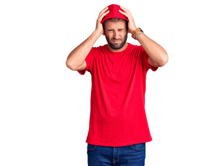 Young handsome blond man wearing t-shirt and cap suffering from headache desperate and stressed because pain and migraine. hands on head.