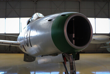 fighter jet airplane in a hangar