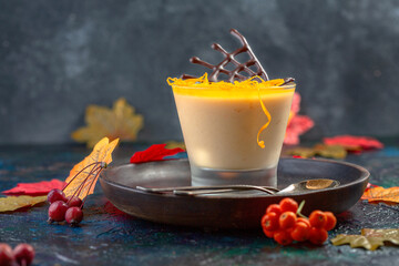 Homemade pumpkin panna cotta with orange jelly.