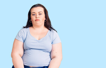 Fototapeta premium Young plus size woman wearing casual clothes depressed and worry for distress, crying angry and afraid. sad expression.