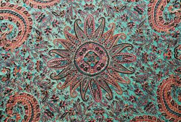 Fototapeta na wymiar Bright traditional oriental pattern on a silk scarf.