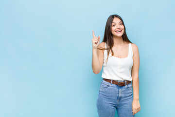 youn pretty woman feeling like a happy and excited genius after realizing an idea, cheerfully...