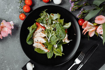 smoked chicken salad on a black plate