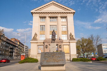 Fototapeta na wymiar The building of Slovak National Museum (Slovenské národné múzeum) in Bratislava, front view, statue of Tomáš Garrigue Masaryk (T. G. Masaryk) on a sunny day