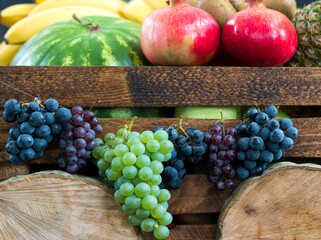 Wooden farm crate filled with fresh tropical fruit