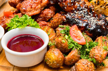 Barbecue chicken with vegetables on wooden table