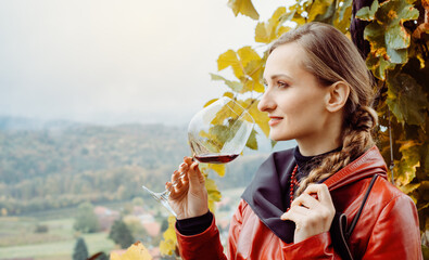 Woman having wine tasting in winery