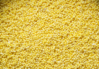 millet groats, ingredient for making a gluten-free vegan or vegetarian dish, top view close up