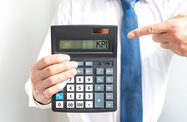 KPI, Key Performance Indicator concept, acronym on cakculator display