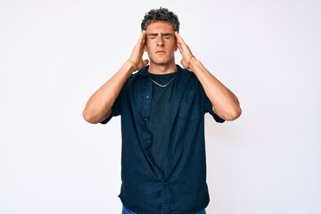 Fototapeta premium Young handsome man wearing casual clothes with hand on head, headache because stress. suffering migraine.
