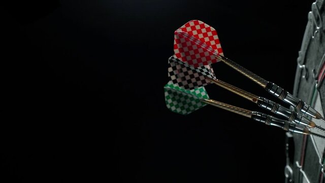 Three darts at triple 20 on the Dartboard.