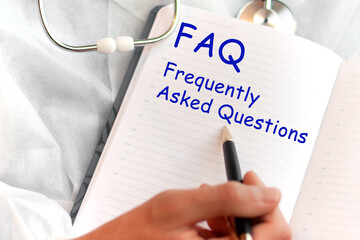Doctor holding a card with text FAQ - Frequently Asked Questions, medical concept