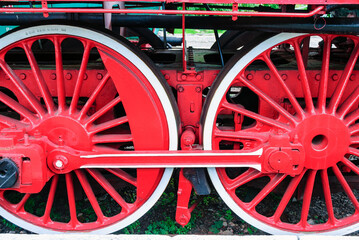 Red wheels of an old locomotive