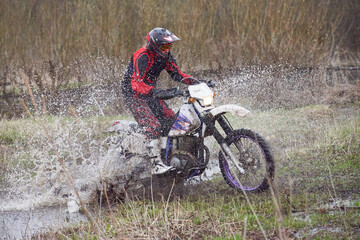 Motorcoss rider racing in the countryside